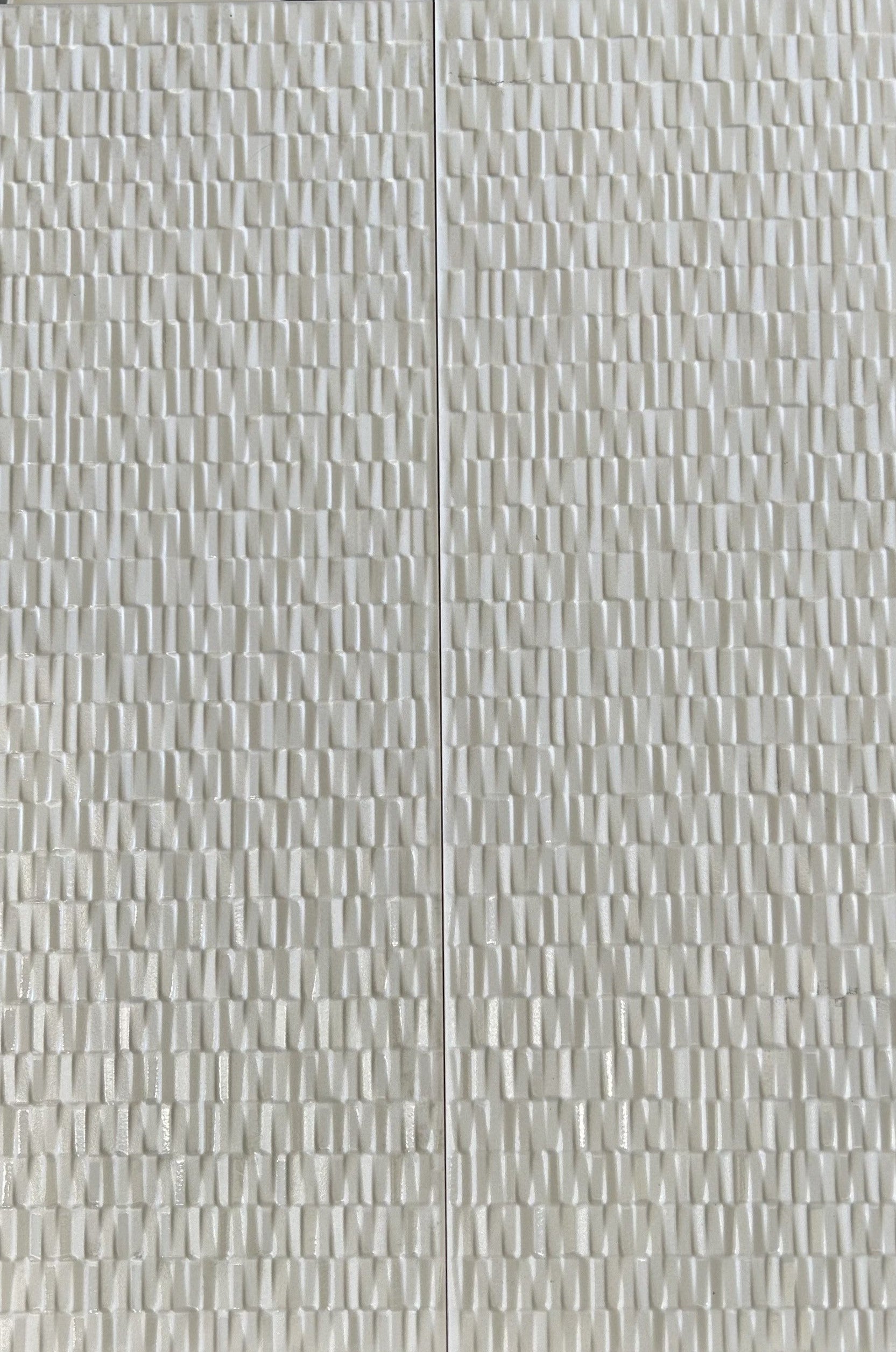 Large rectangular white tiles with a feature design