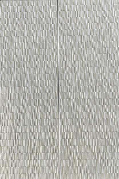 Large rectangular white tiles with a feature design